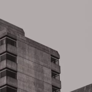 Brutalist government building with surveillance cameras symbolizing state control and structural power in urban environments.